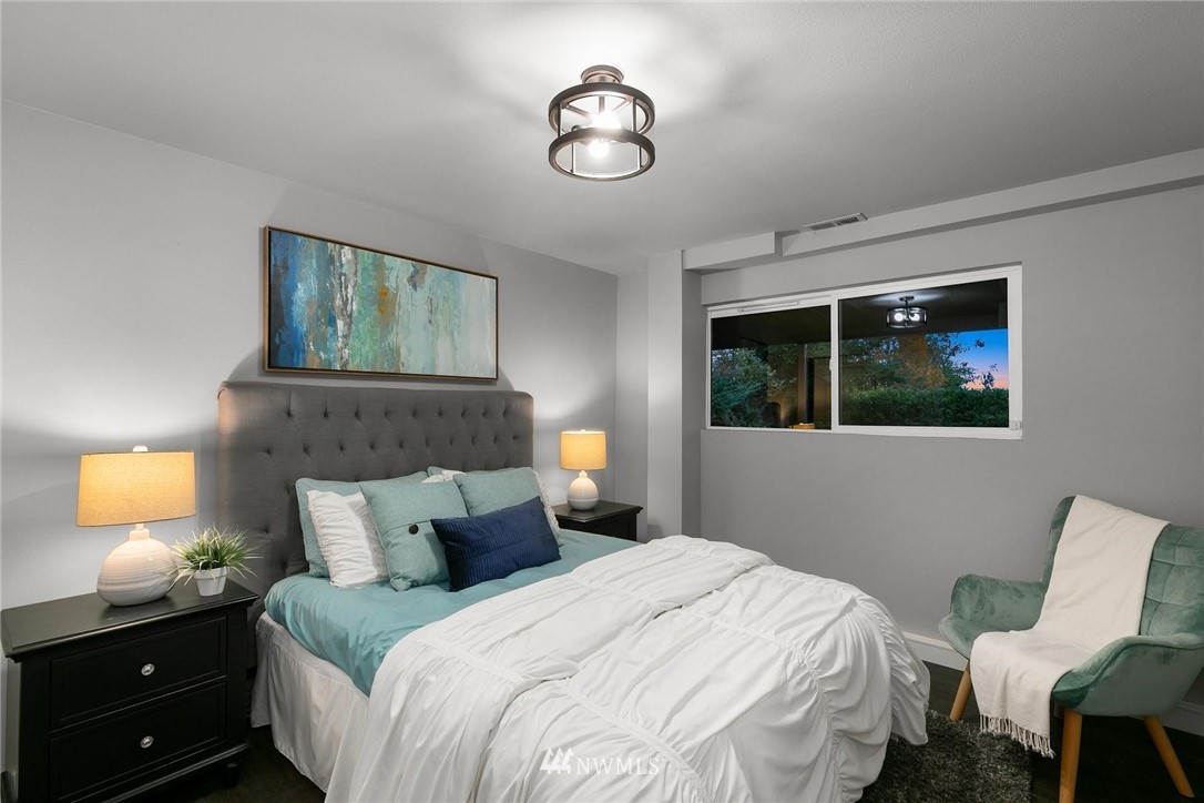 12110 Southeast 60th Place Bellevue, WA 98006 - Photo 20 of 32 a bedroom with a bed and window