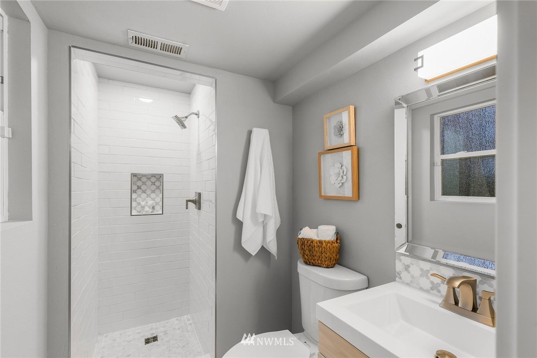 12110 Southeast 60th Place Bellevue, WA 98006 - Photo 21 of 32 a bathroom with a sink toilet and shower