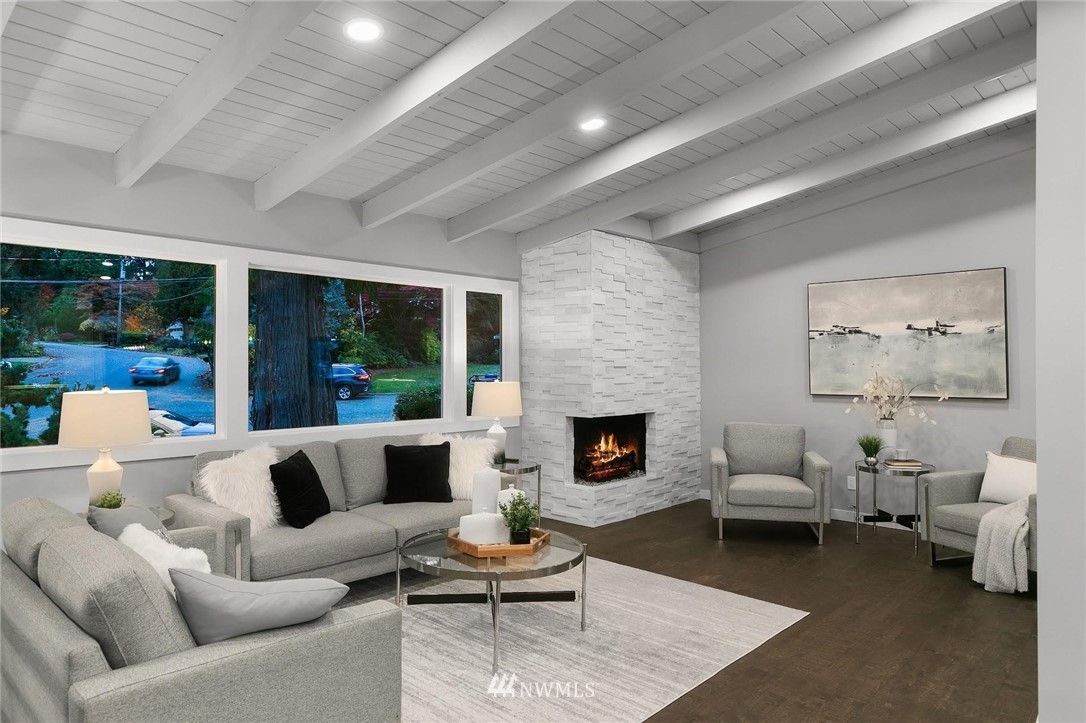 12110 Southeast 60th Place Bellevue, WA 98006 - Photo 5 of 32 a living room with furniture wooden floor and a fireplace