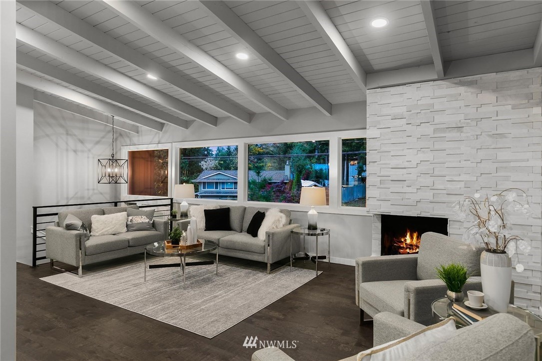 12110 Southeast 60th Place Bellevue, WA 98006 - Photo 6 of 32 a living room with furniture and a fireplace