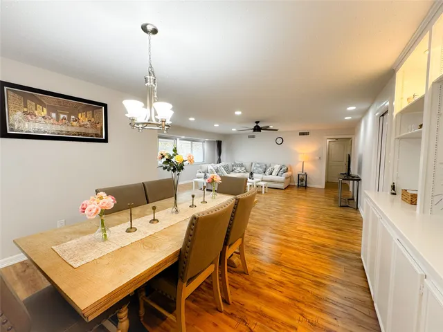 a very nice looking dining room with a table and chairs