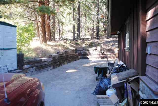 355 Andria Drive Stateline, NV 89449 - Photo 11 of 13 a view of a patio with table and chairs with wooden floor and fence