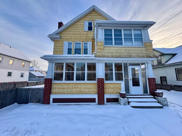 front view of a house with a large window