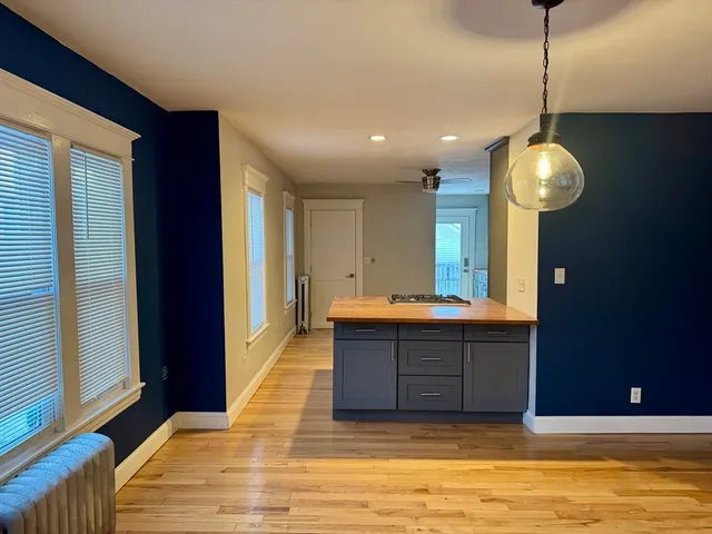 a view of a kitchen and a chandelier