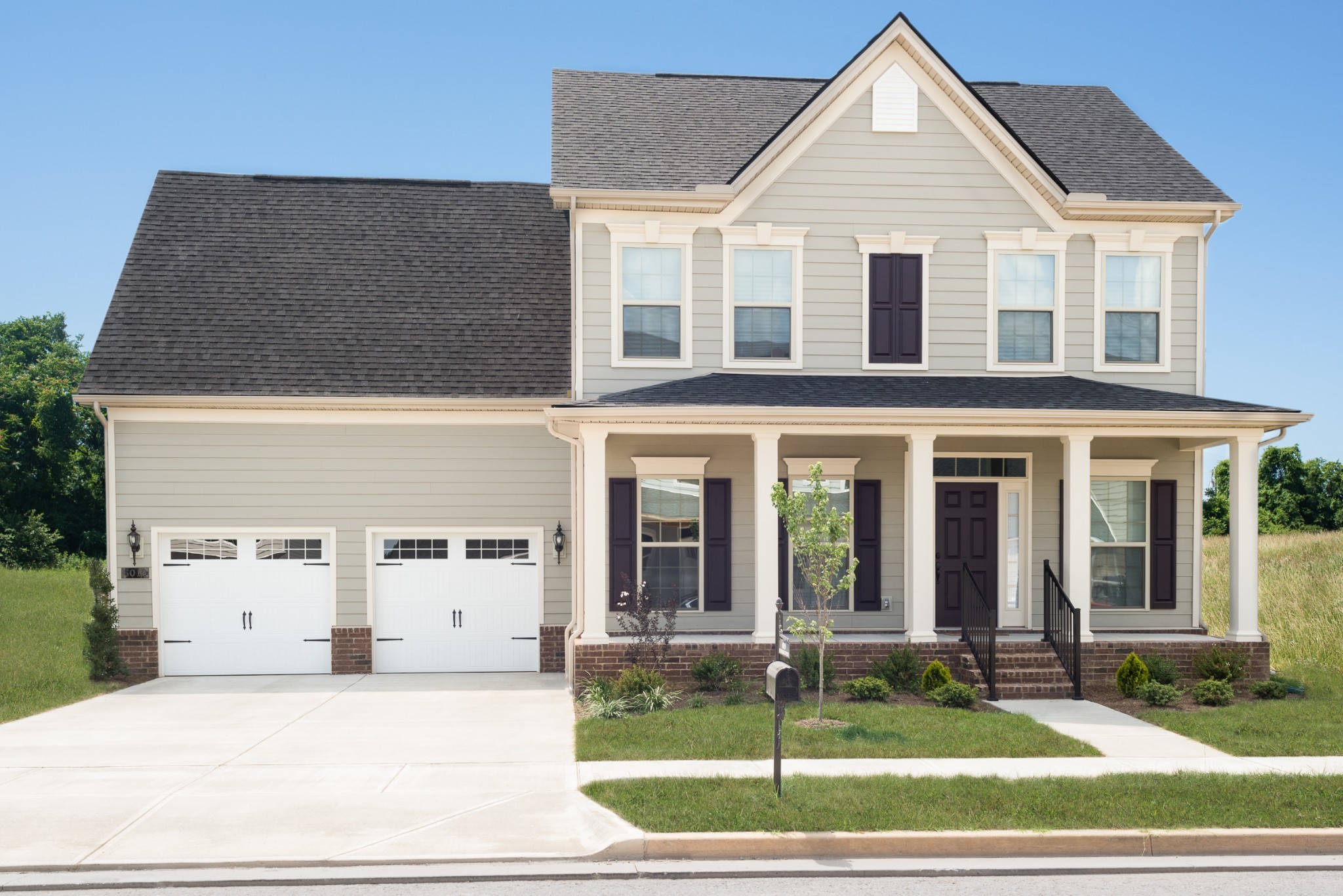 4019 Oglethorpe Drive Franklin, TN 37064 - Photo 2 of 31 a view of a white house with a yard in front of it