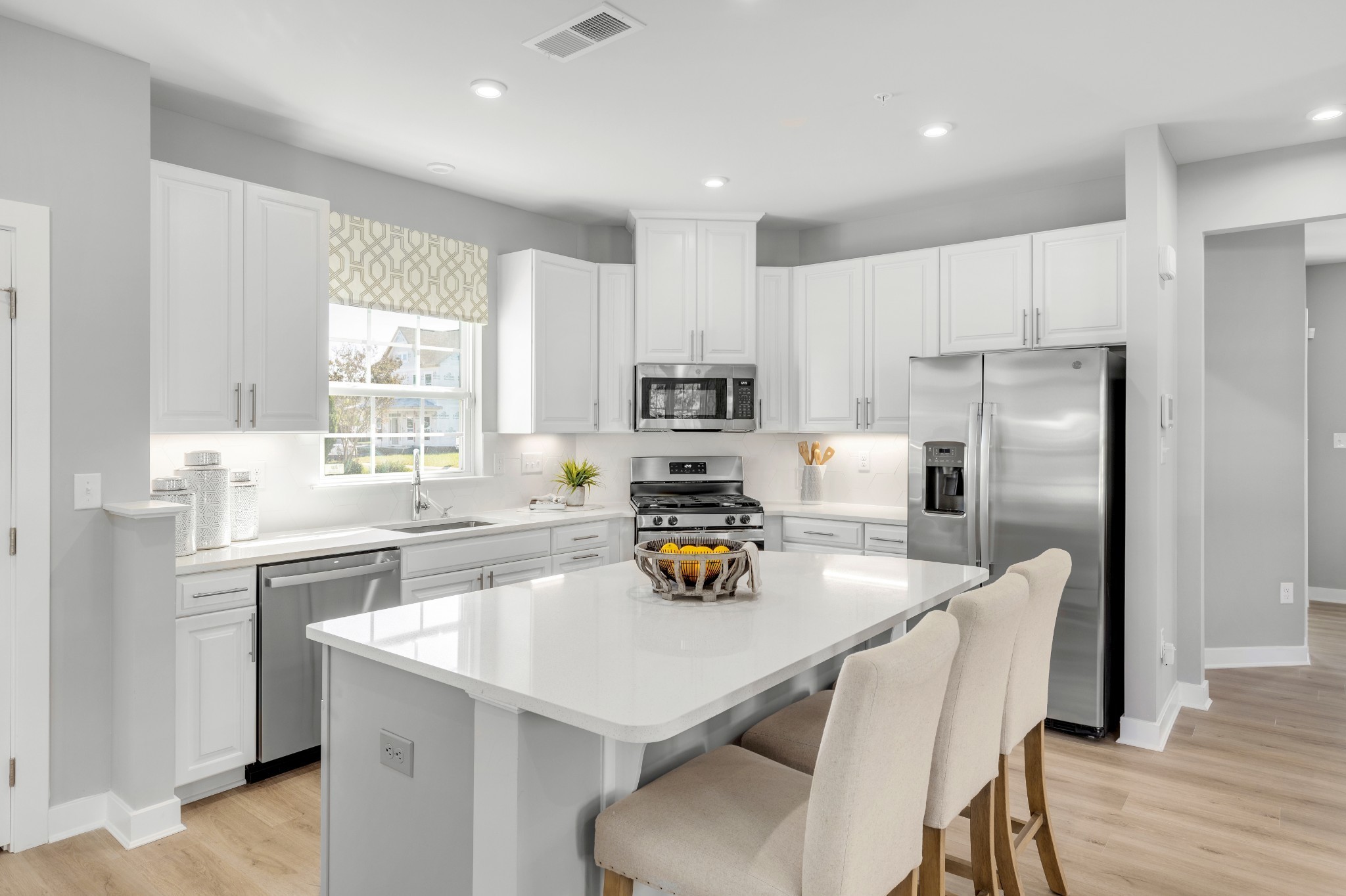 4019 Oglethorpe Drive Franklin, TN 37064 - Photo 24 of 31 a kitchen with a sink a refrigerator and wooden cabinets