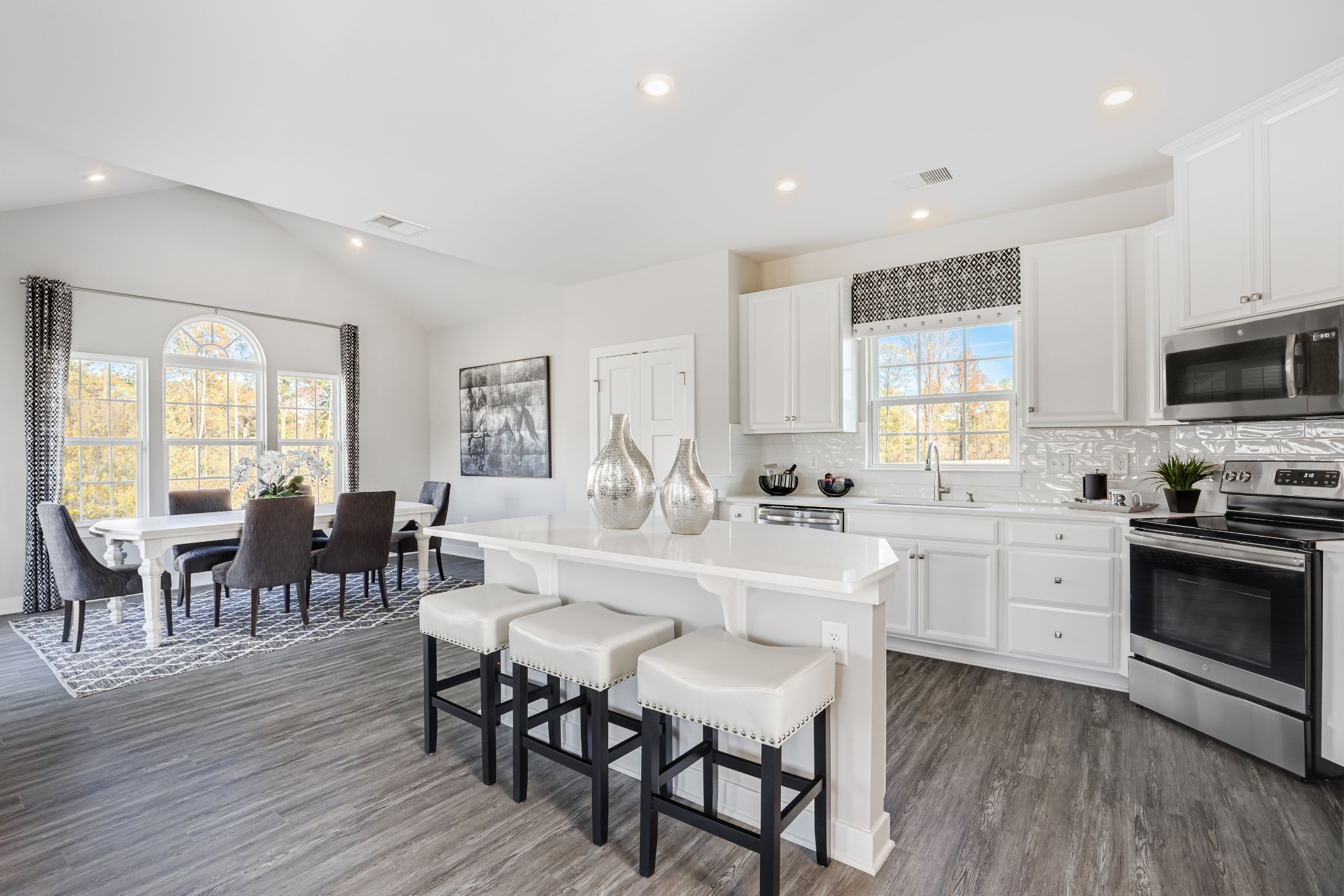 4019 Oglethorpe Drive Franklin, TN 37064 - Photo 9 of 31 a large kitchen with lots of furniture and stainless steel appliances