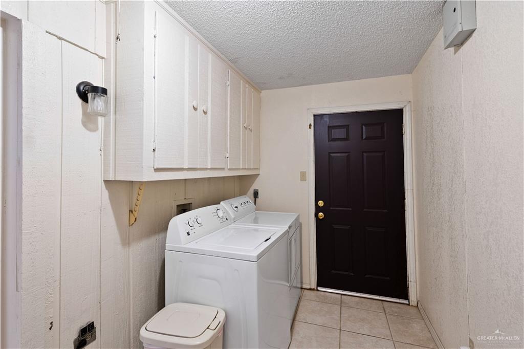501 South Greene Road Mission, TX 78572 - Photo 12 of 28 a utility room with dryer and washer