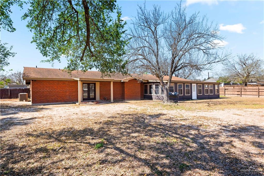 501 South Greene Road Mission, TX 78572 - Photo 25 of 28 a front view of a house with a yard and garage