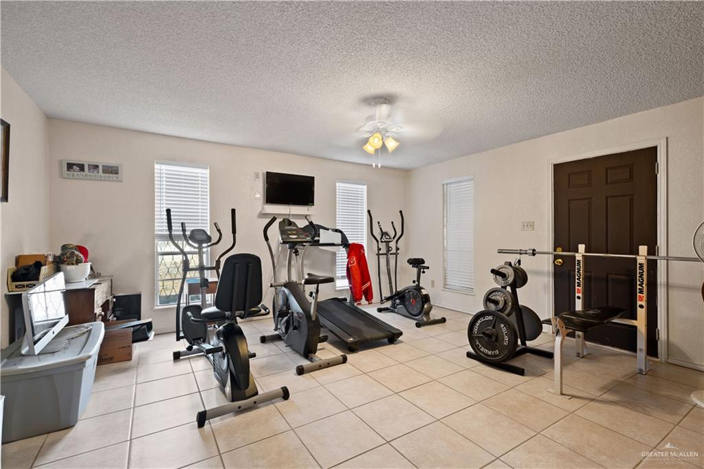 501 South Greene Road Mission, TX 78572 - Photo 10 of 28 a view of a room with gym equipment