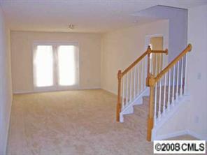 16868 Timber Crossing Road Charlotte, NC 28213 - Photo 6 of 8 a view of an empty room with stairs