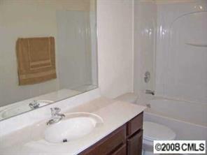 16868 Timber Crossing Road Charlotte, NC 28213 - Photo 7 of 8 a bathroom with a sink a vanity and a bathtub