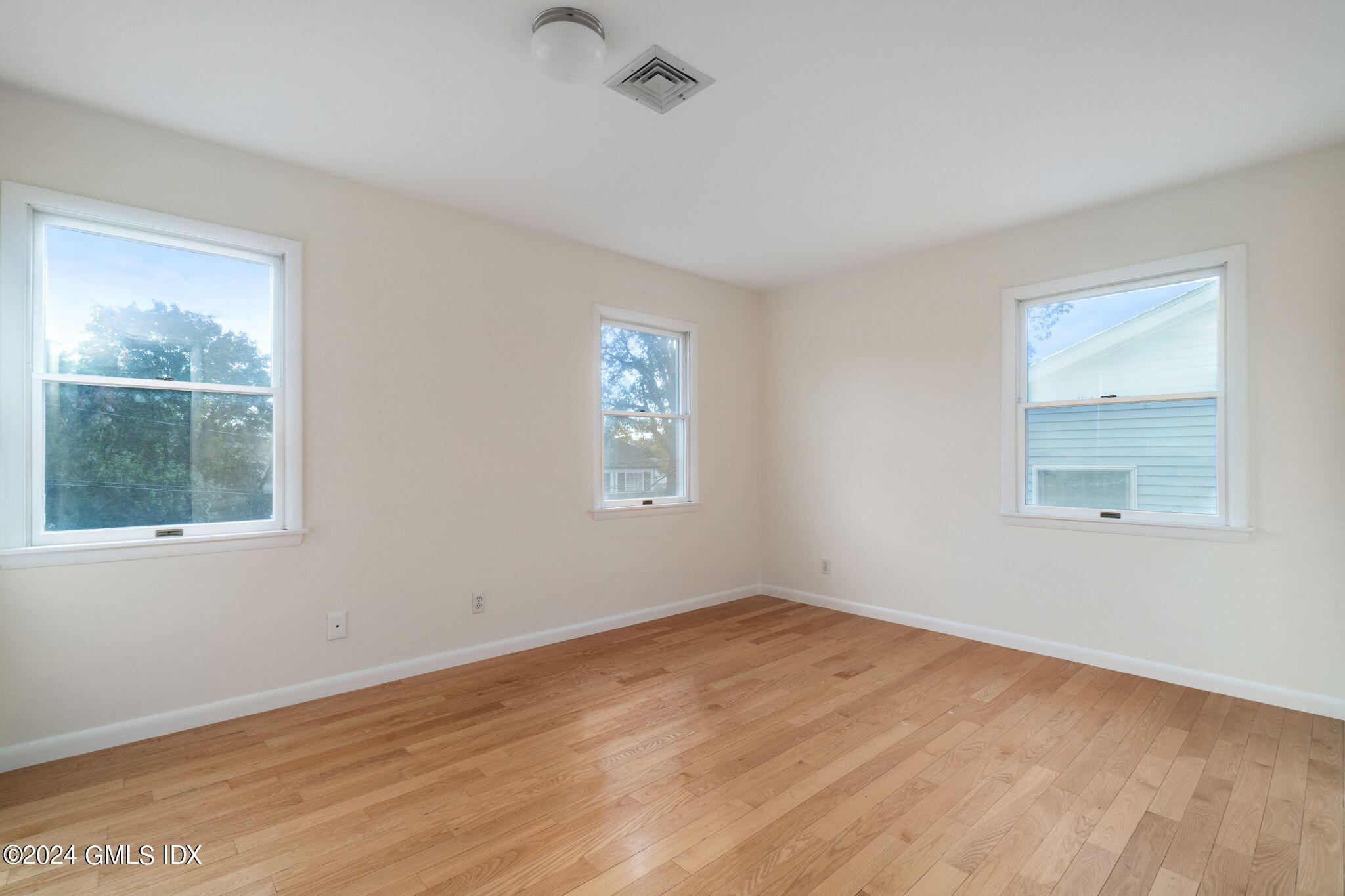 10 Tulip Street, Unit A Cos Cob, CT 06807 - Photo 14 of 27 an empty room with a window