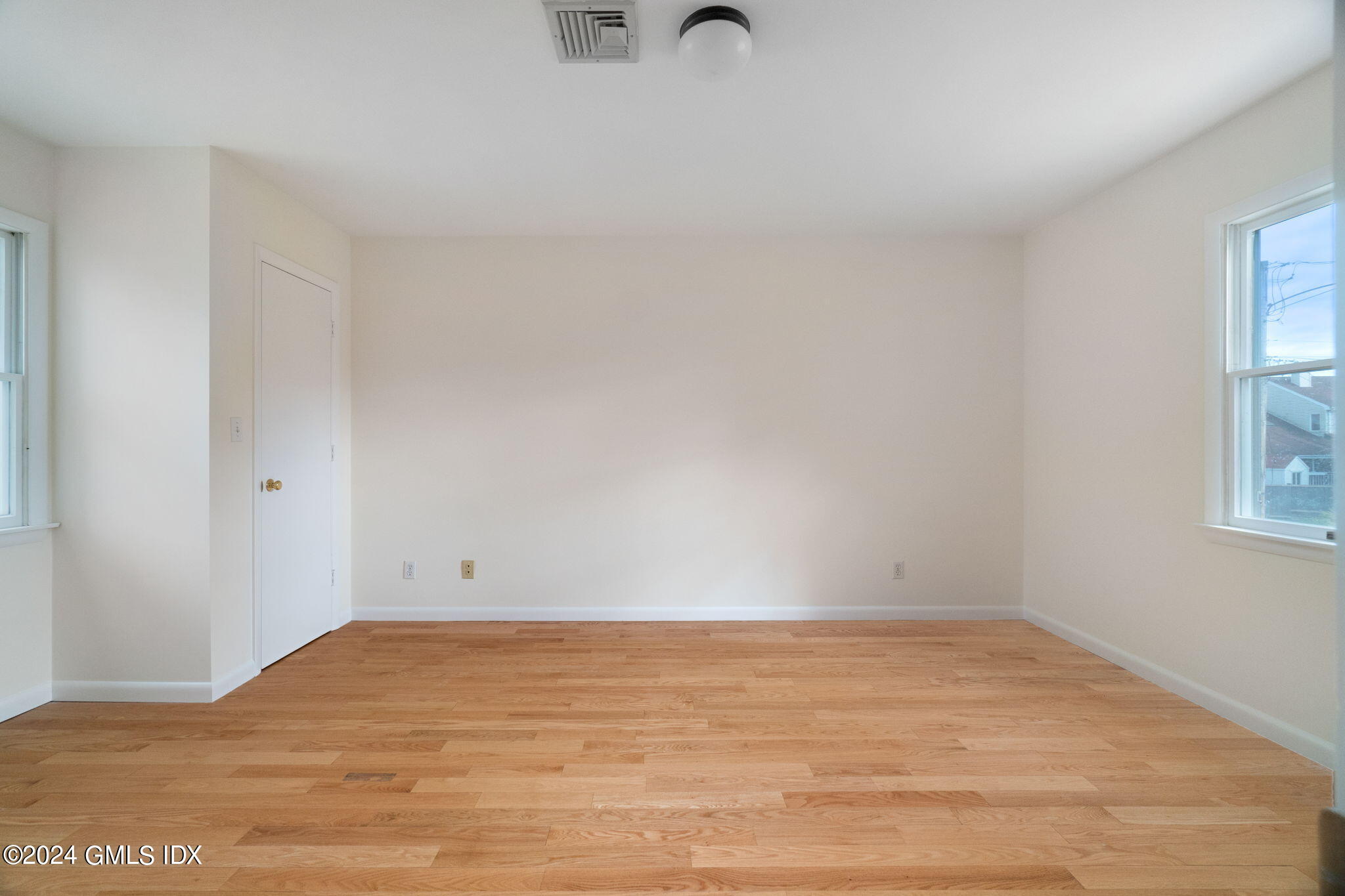 10 Tulip Street, Unit A Cos Cob, CT 06807 - Photo 15 of 27 a view of empty room with window