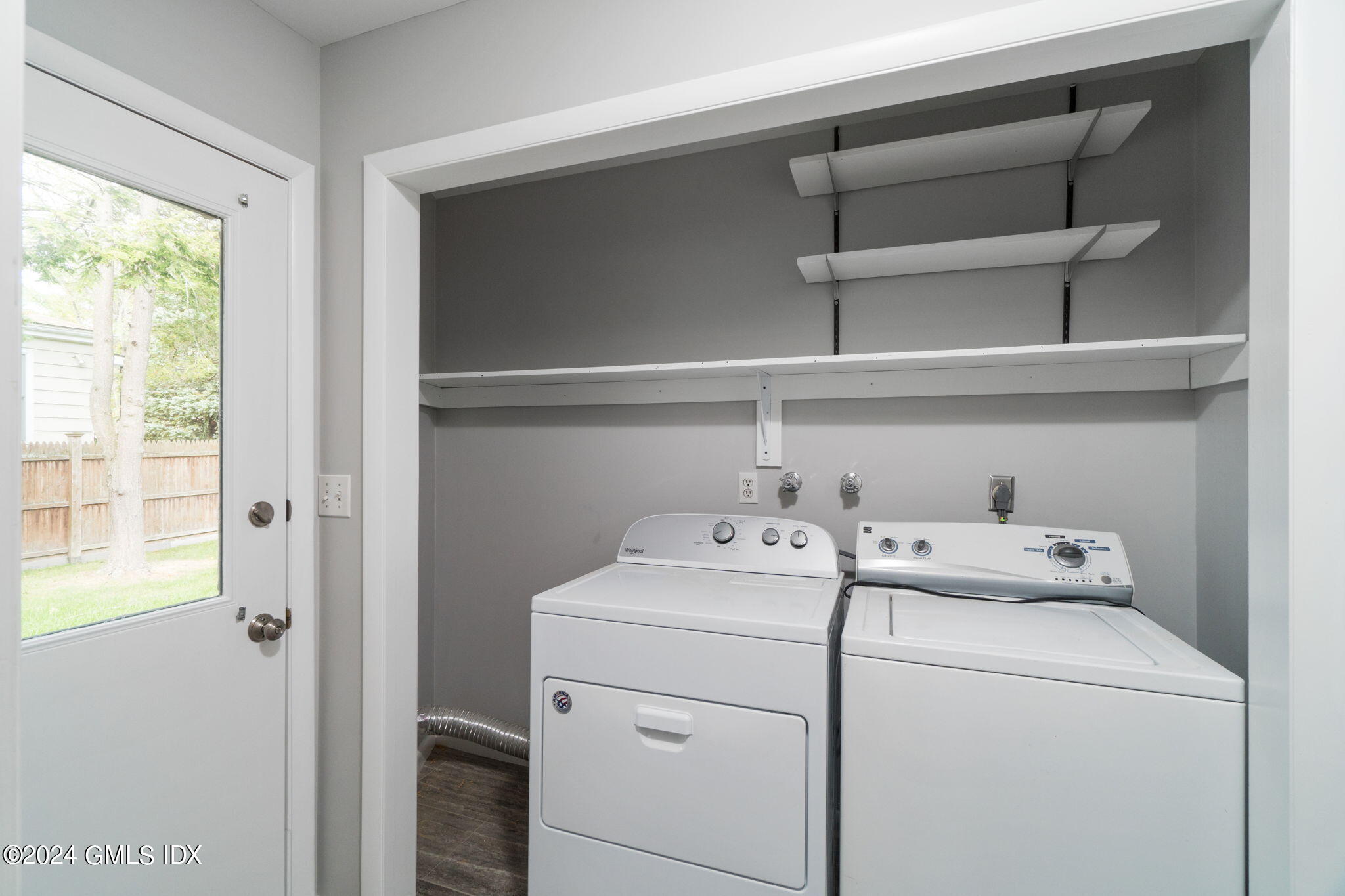 10 Tulip Street, Unit A Cos Cob, CT 06807 - Photo 18 of 27 a utility room with dryer and washer