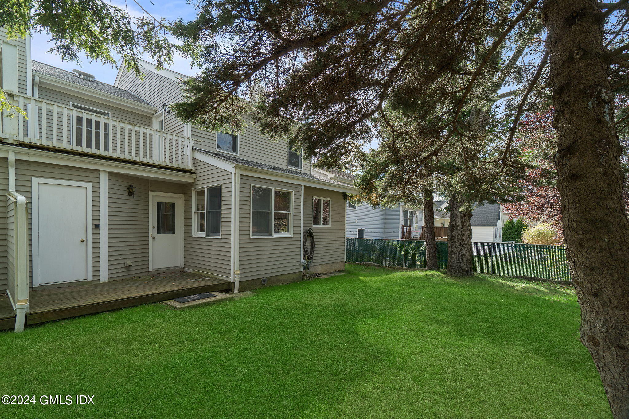 10 Tulip Street, Unit A Cos Cob, CT 06807 - Photo 22 of 27 front view of a house with a yard