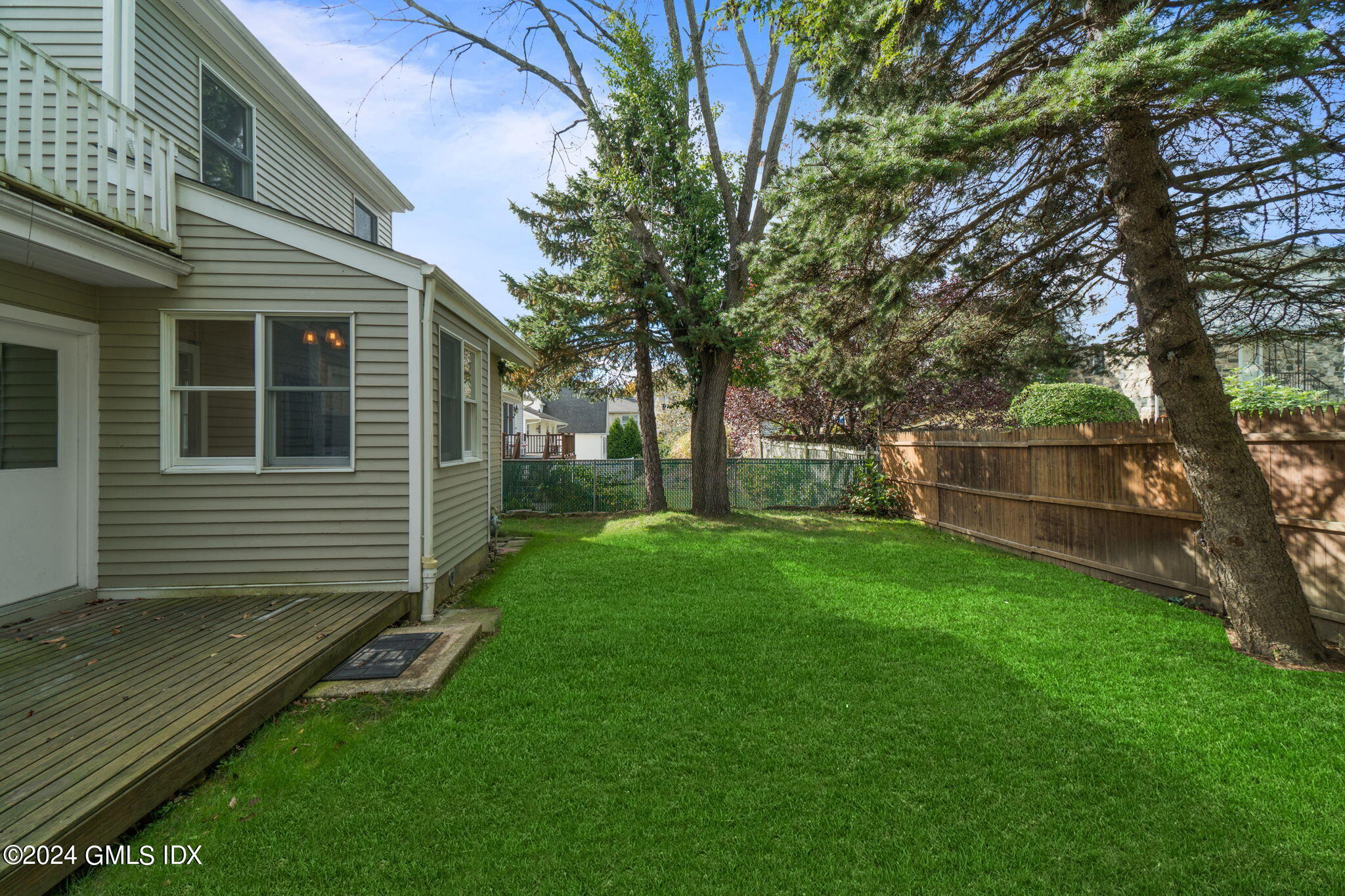 10 Tulip Street, Unit A Cos Cob, CT 06807 - Photo 27 of 27 a view of a house with a yard