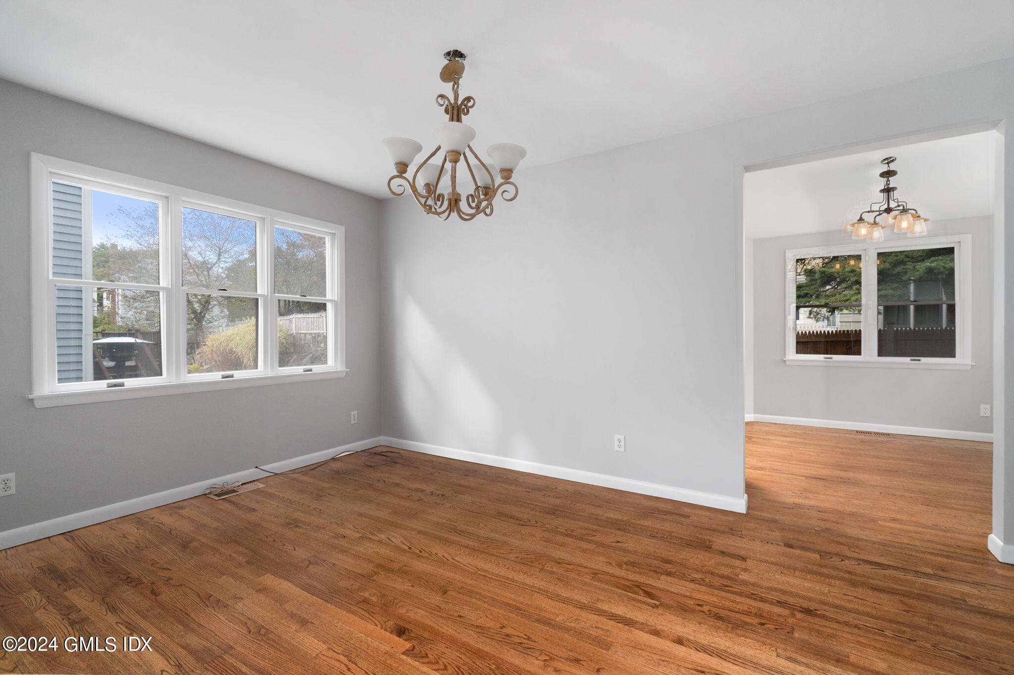 10 Tulip Street, Unit A Cos Cob, CT 06807 - Photo 8 of 27 a view of an empty room with wooden floor and a window