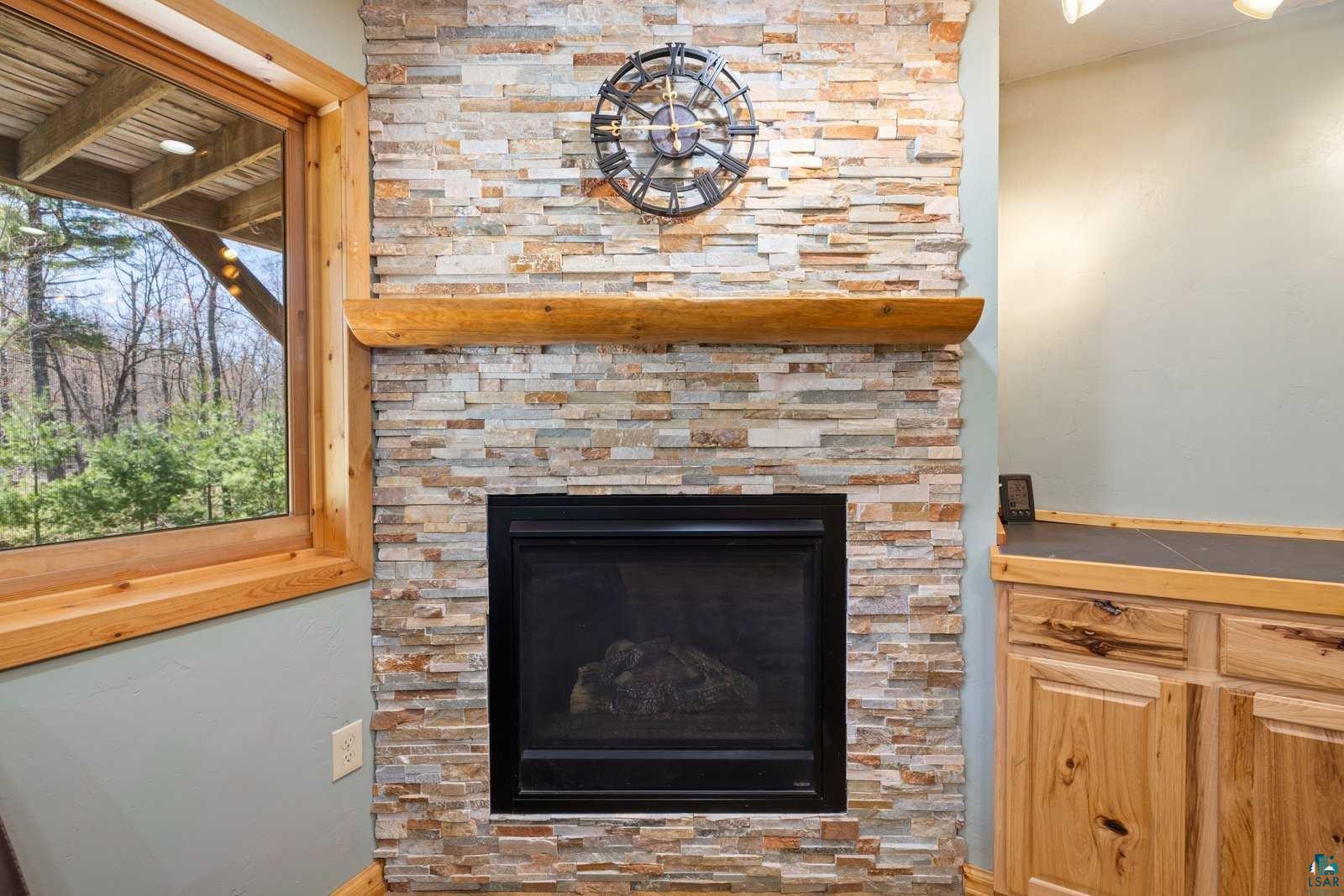 12957 West Ridge Road Ely, MN 55731 - Photo 20 of 41 Room details with baseboards and a fireplace