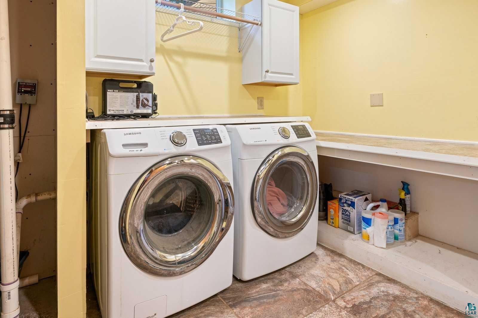 12957 West Ridge Road Ely, MN 55731 - Photo 25 of 41 Clothes washing area featuring washer and dryer and cabinet space