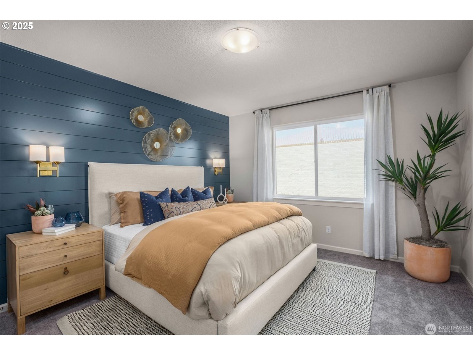 2822 South 9th Avenue Ridgefield, WA 98642 - Photo 14 of 27 a bedroom with a bed and a potted plant