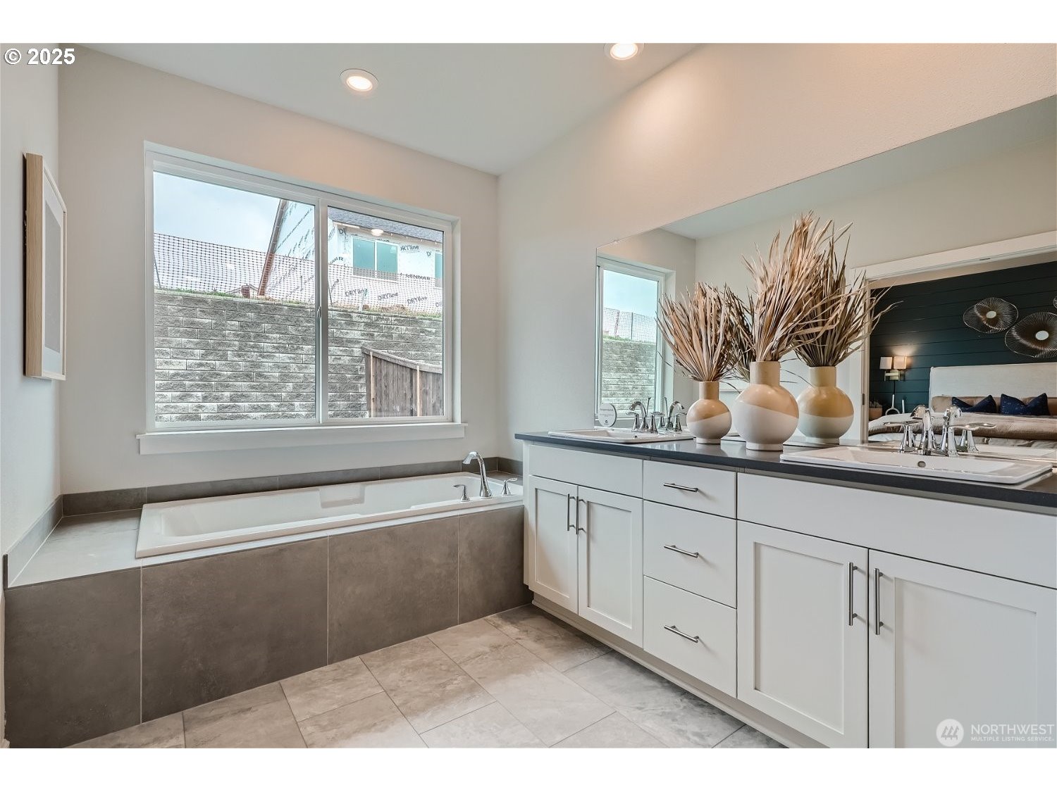2822 South 9th Avenue Ridgefield, WA 98642 - Photo 16 of 27 a bathroom with a tub a sink and mirror