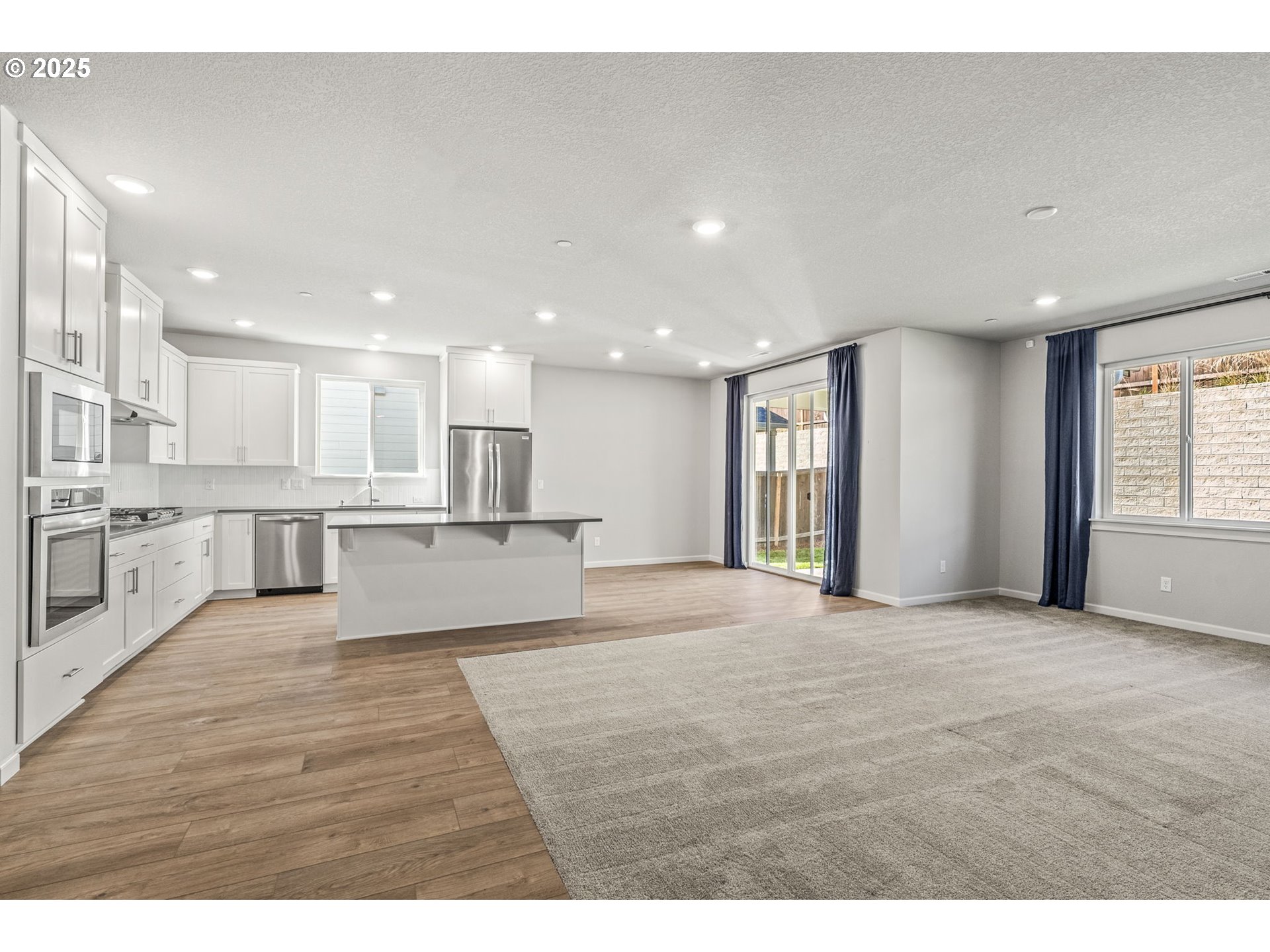 2822 South 9th Avenue Ridgefield, WA 98642 - Photo 20 of 27 a view of large kitchen with large window and wooden floor