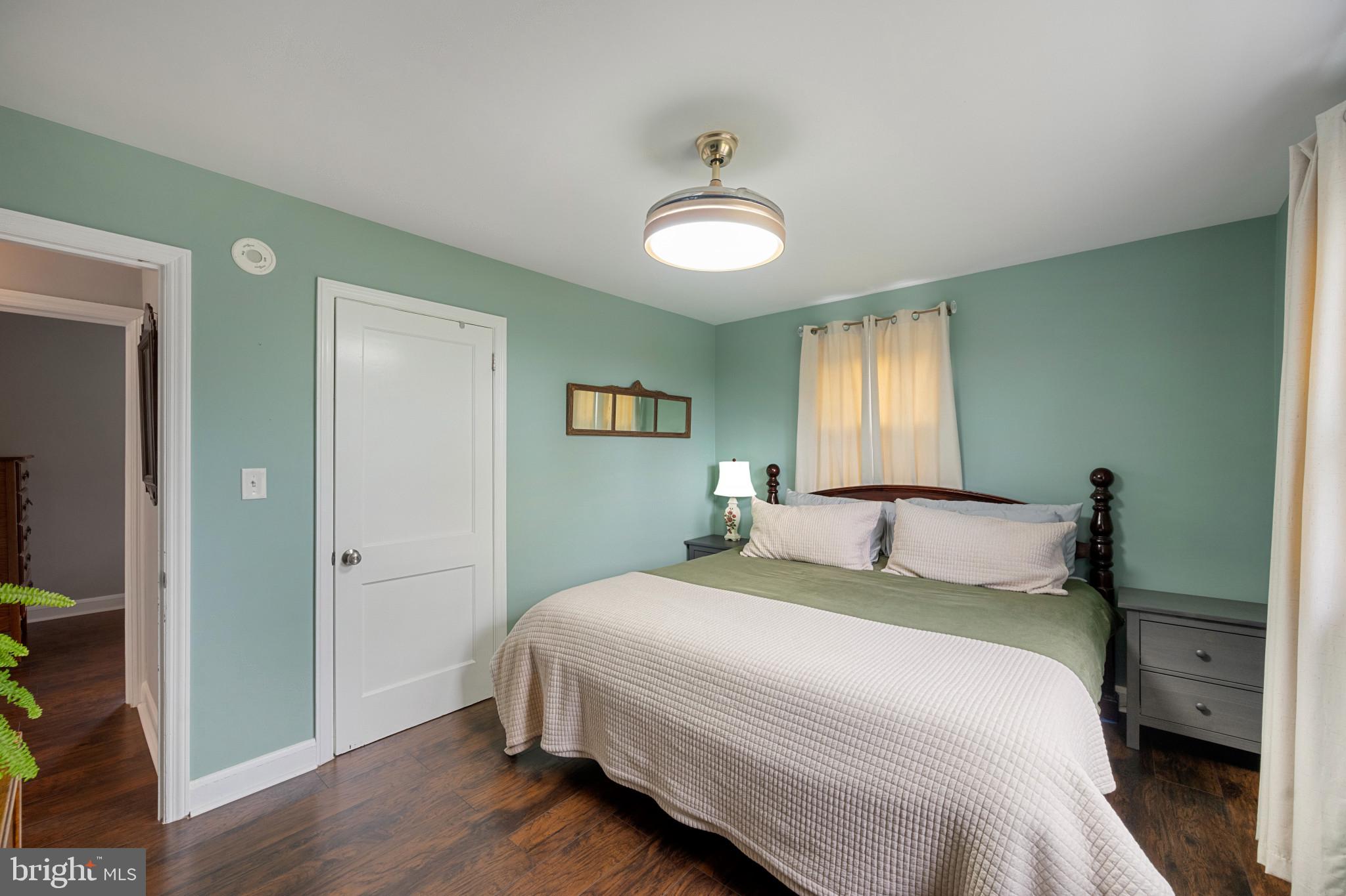 705 Longview Avenue Westminster, MD 21157 - Photo 13 of 30 a bedroom with a bed and a chandelier