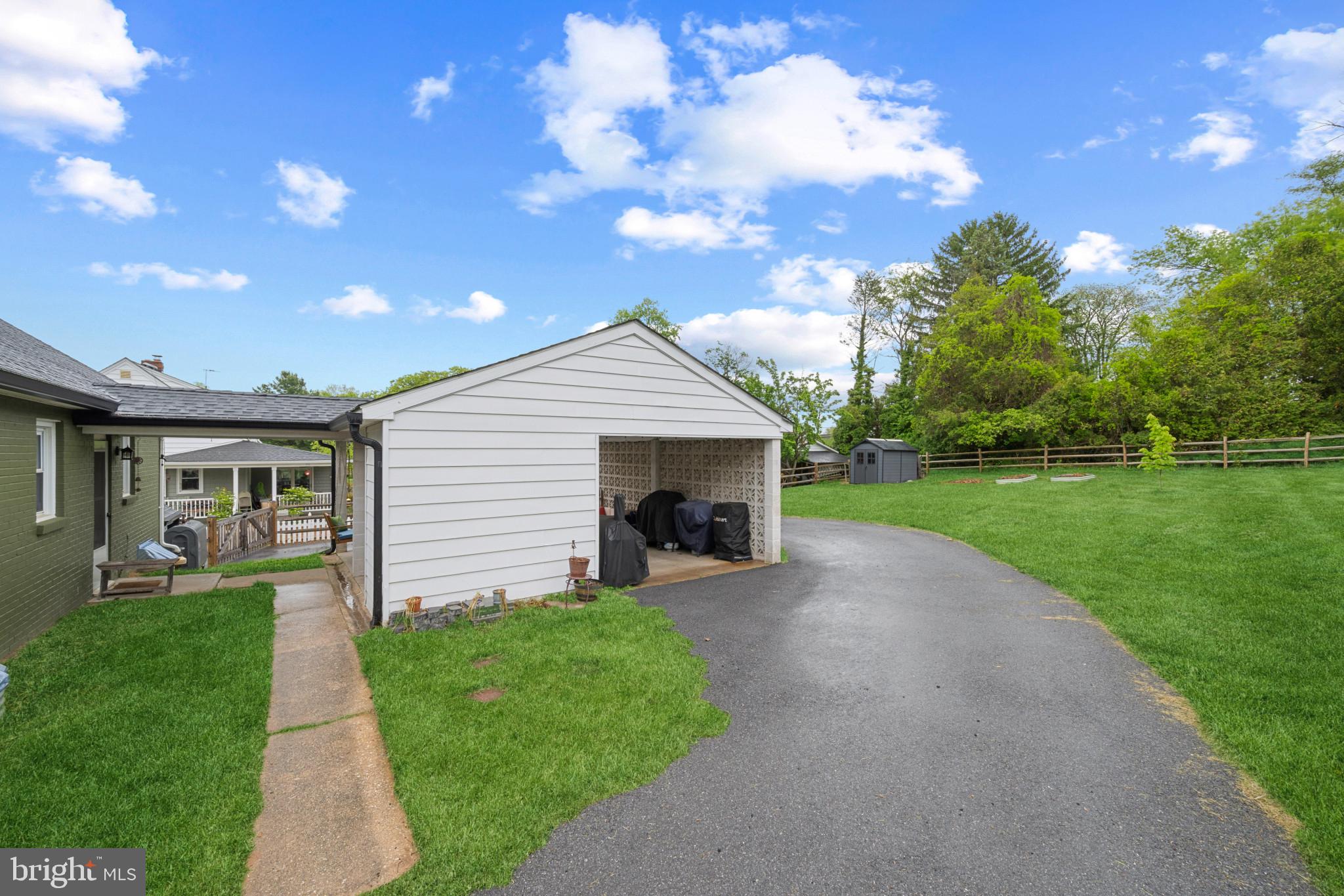 705 Longview Avenue Westminster, MD 21157 - Photo 29 of 30 a front view of a house with a garden and yard