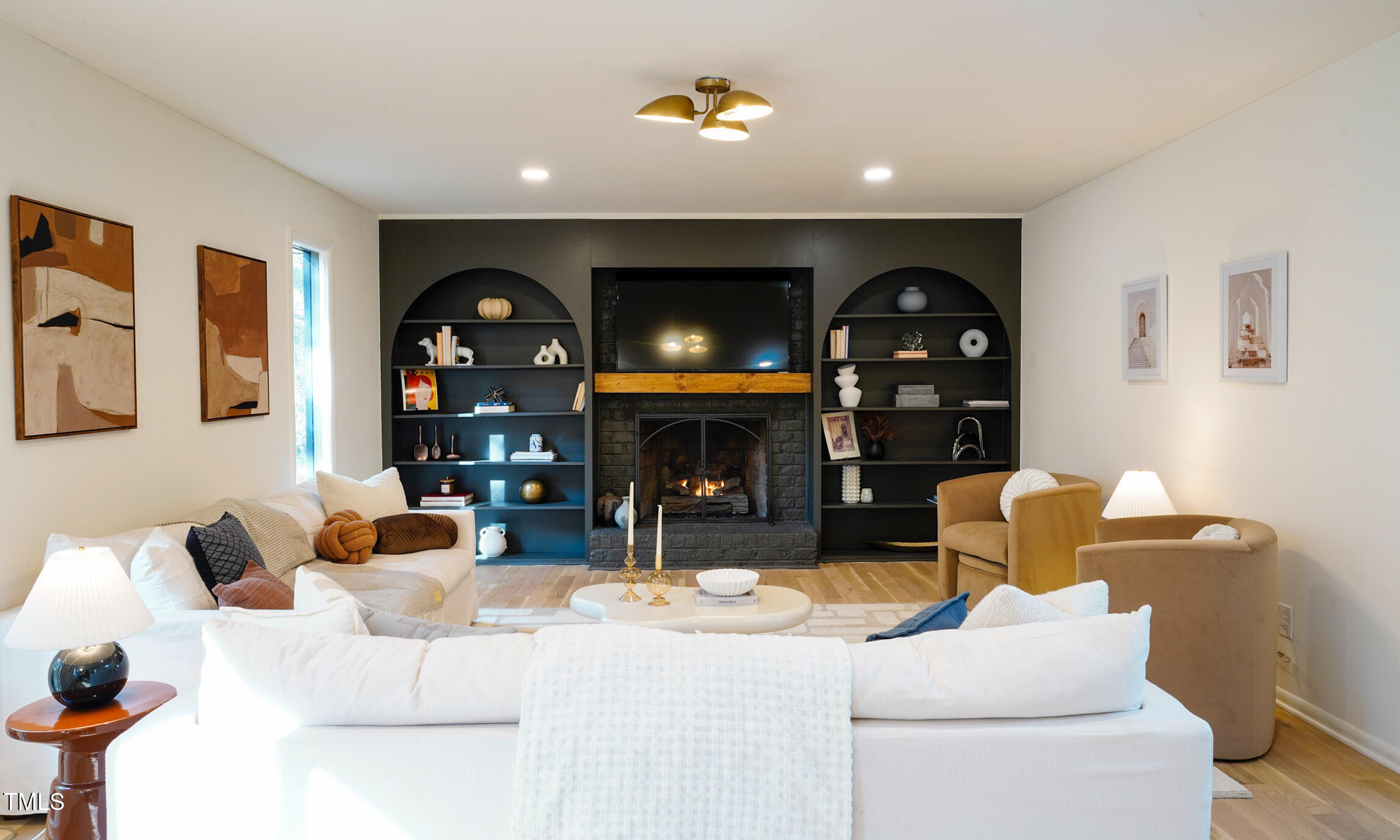 225 Woods Ream Drive Raleigh, NC 27615 - Photo 13 of 45 a living room with furniture and a fireplace