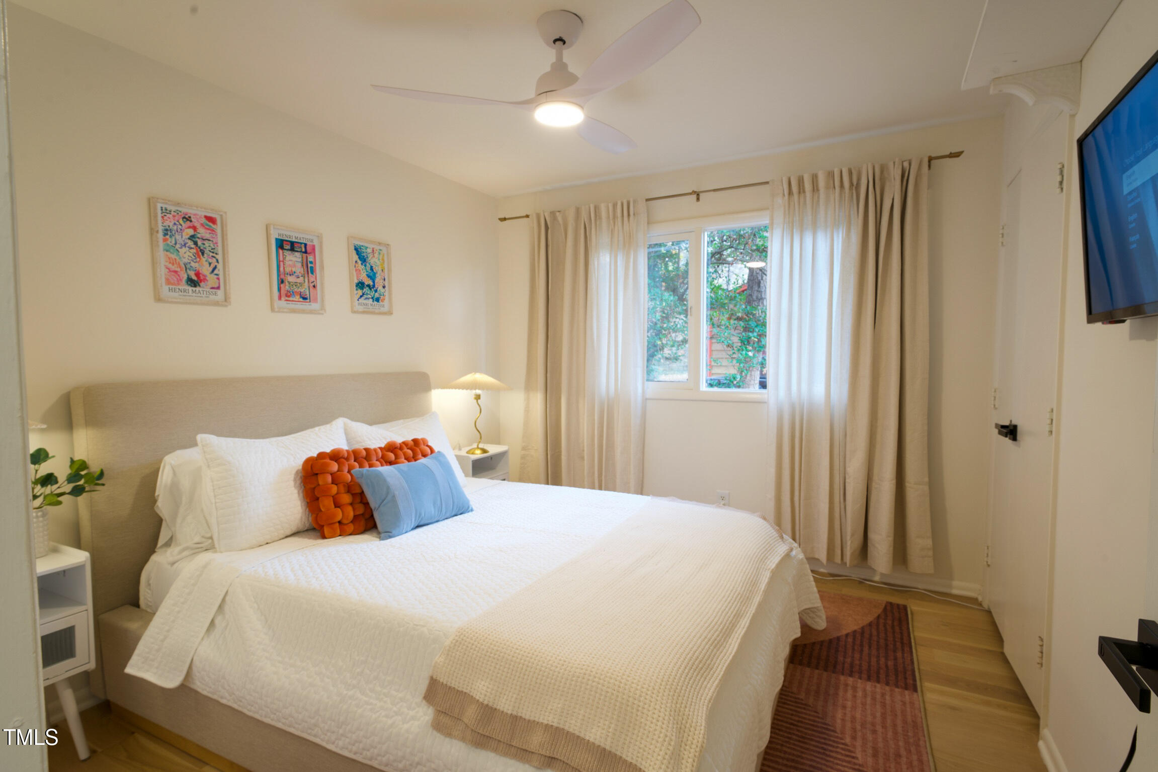 225 Woods Ream Drive Raleigh, NC 27615 - Photo 21 of 45 a bedroom with a bed and a window