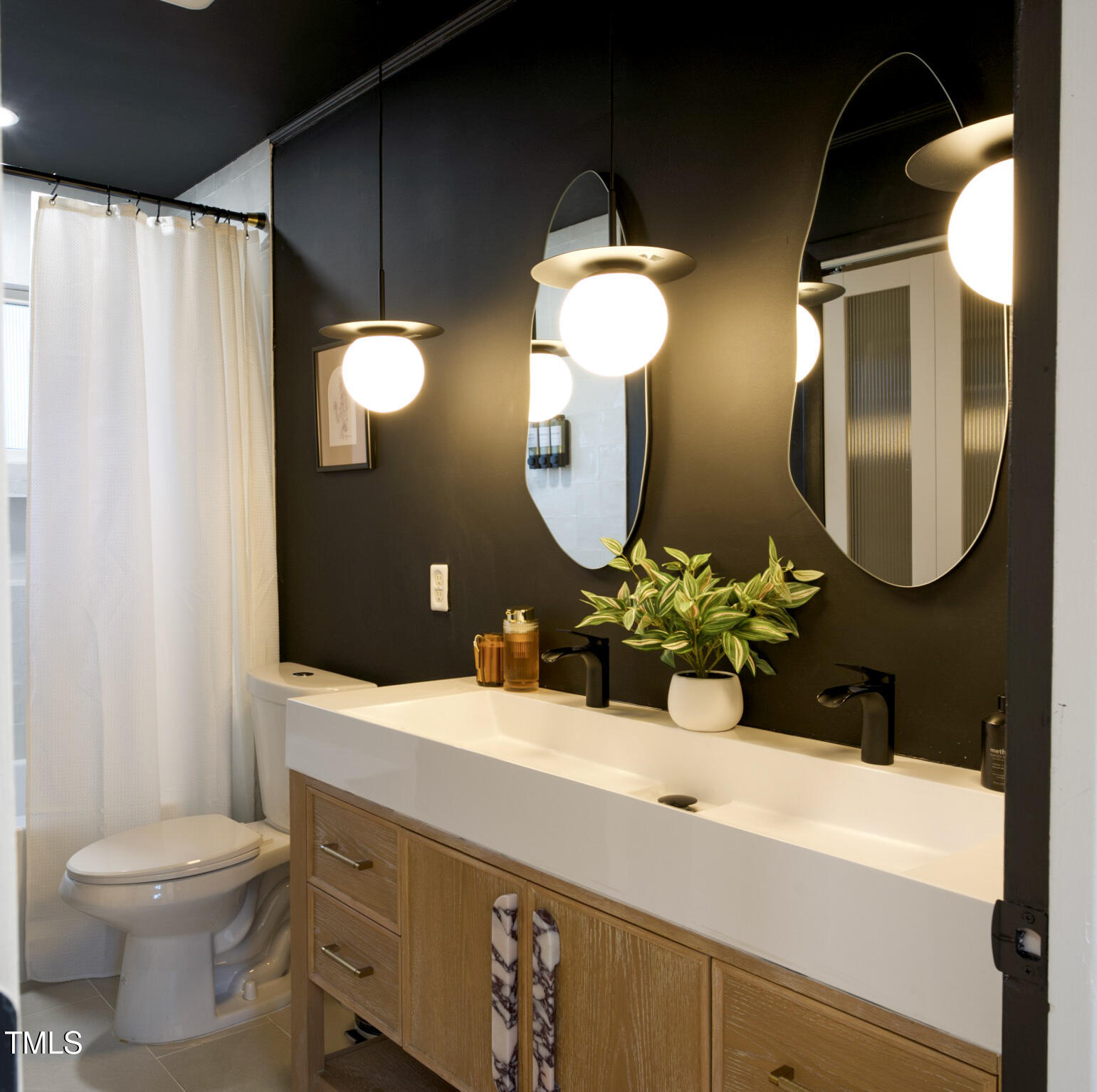 225 Woods Ream Drive Raleigh, NC 27615 - Photo 22 of 45 a bathroom with a double vanity sink and a mirror
