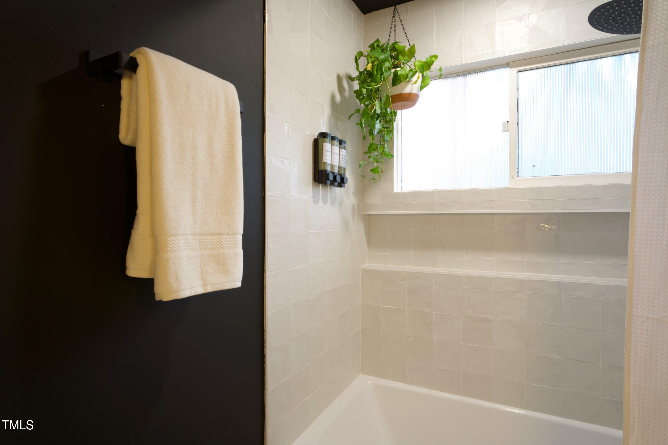 225 Woods Ream Drive Raleigh, NC 27615 - Photo 23 of 45 a bathroom with a bathtub and a shower
