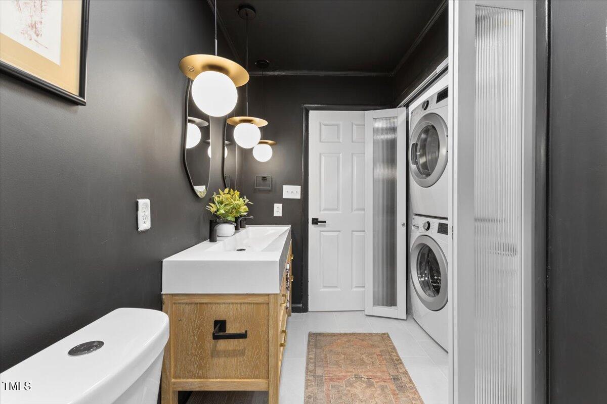 225 Woods Ream Drive Raleigh, NC 27615 - Photo 24 of 45 a bathroom with a sink mirror and toilet