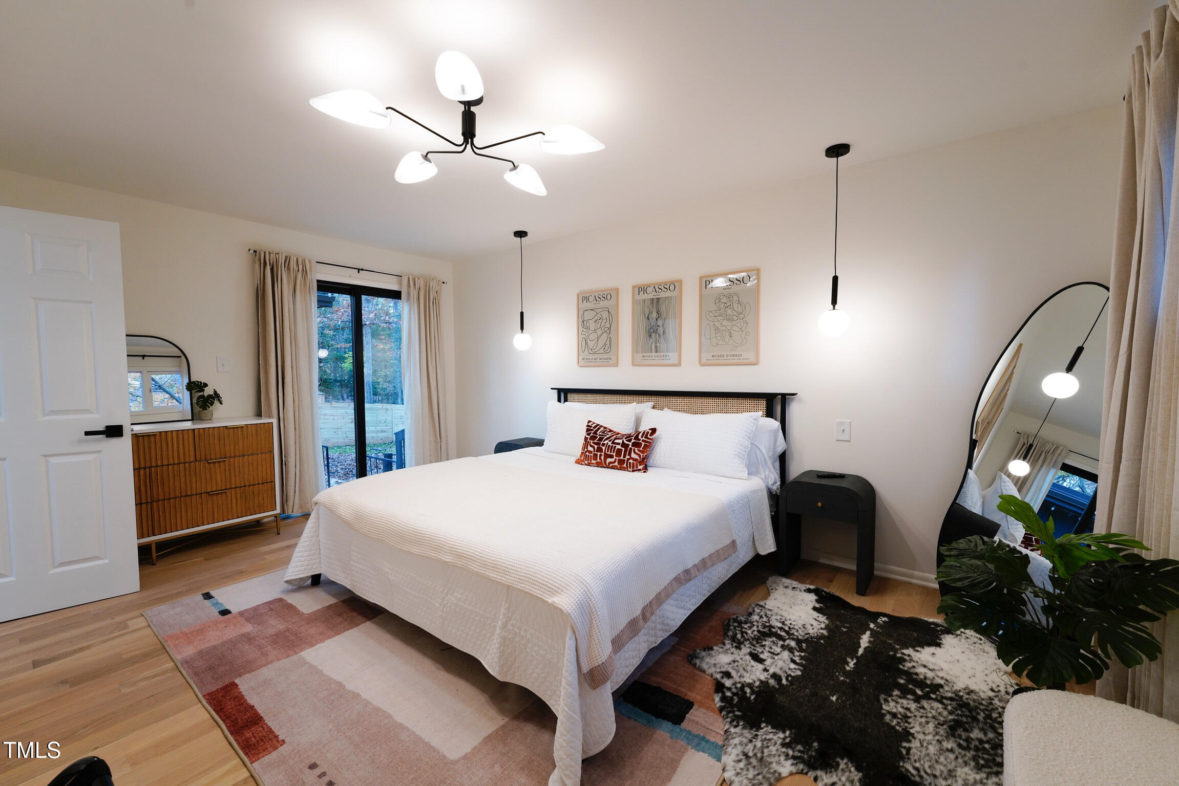 225 Woods Ream Drive Raleigh, NC 27615 - Photo 27 of 45 a bedroom with a bed chandelier and a window
