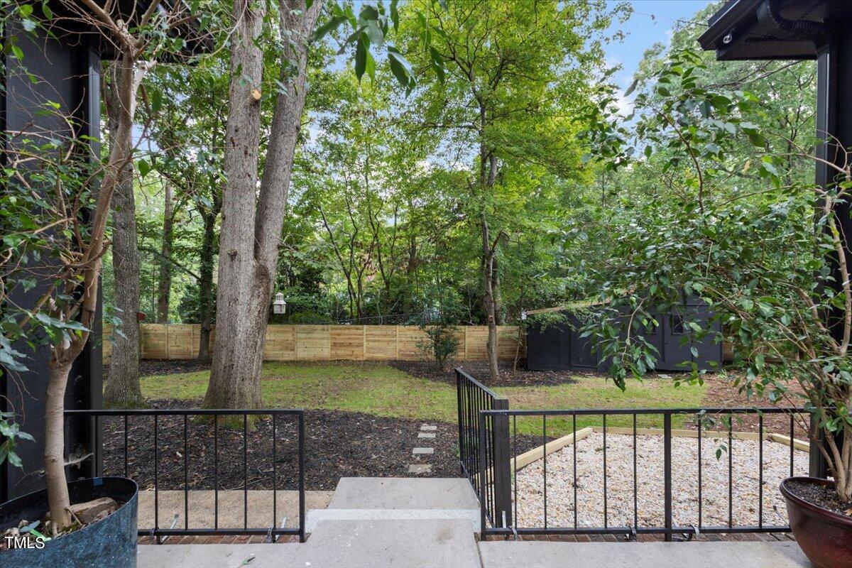 225 Woods Ream Drive Raleigh, NC 27615 - Photo 34 of 45 a view of a wooden deck with a trees