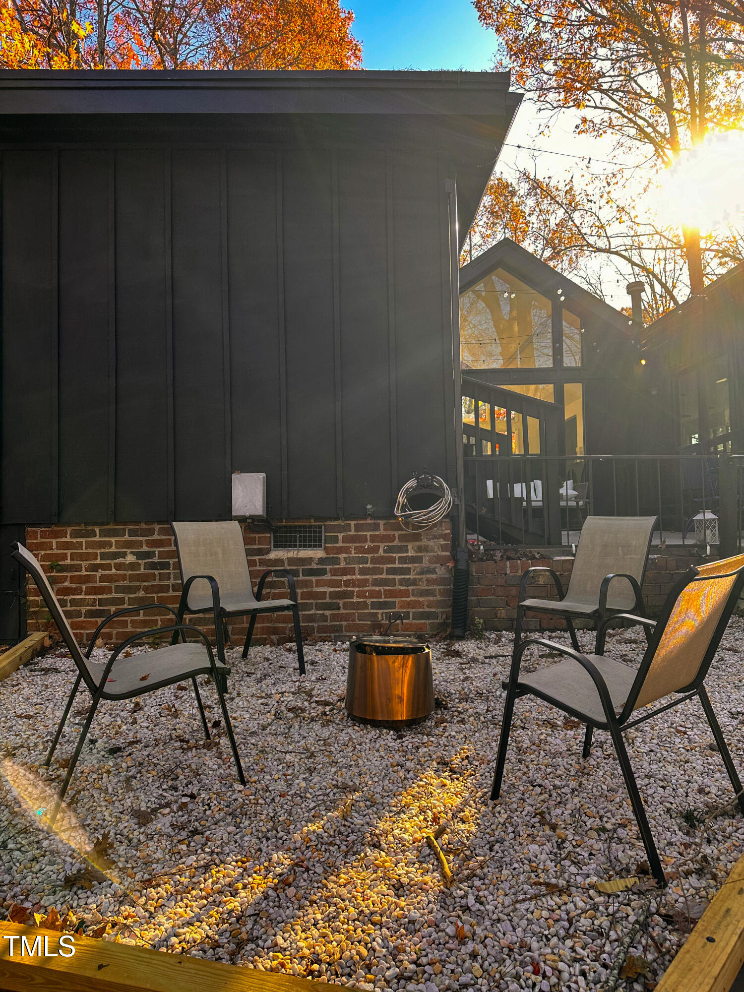 225 Woods Ream Drive Raleigh, NC 27615 - Photo 39 of 45 a backyard of a house with table and chairs