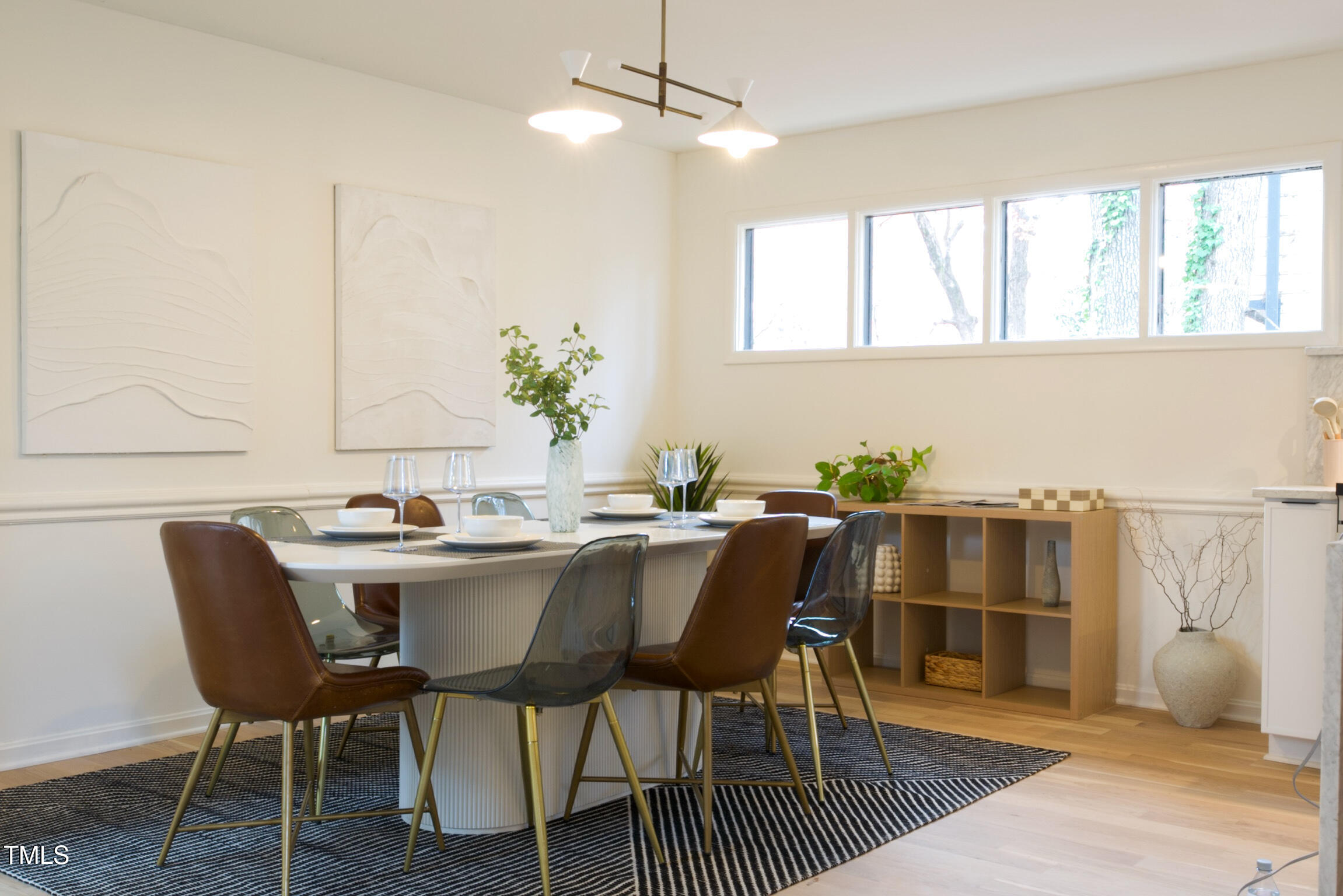 225 Woods Ream Drive Raleigh, NC 27615 - Photo 9 of 45 a view of a dining room with furniture and wooden floor