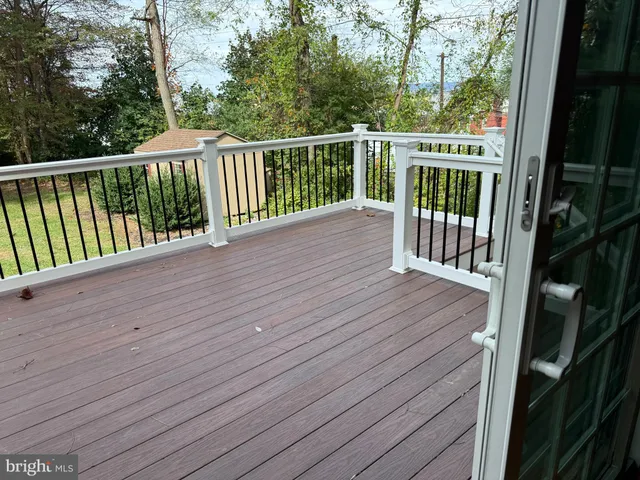 a view of balcony with wooden floor