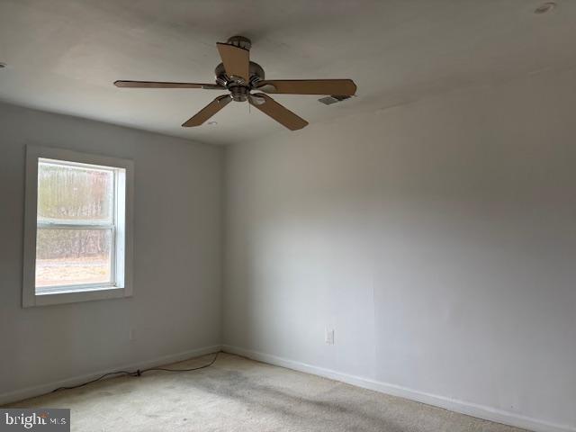 26445 Rapidan Road Rapidan, VA 22733 - Photo 2 of 6 an empty room with a window and a fan