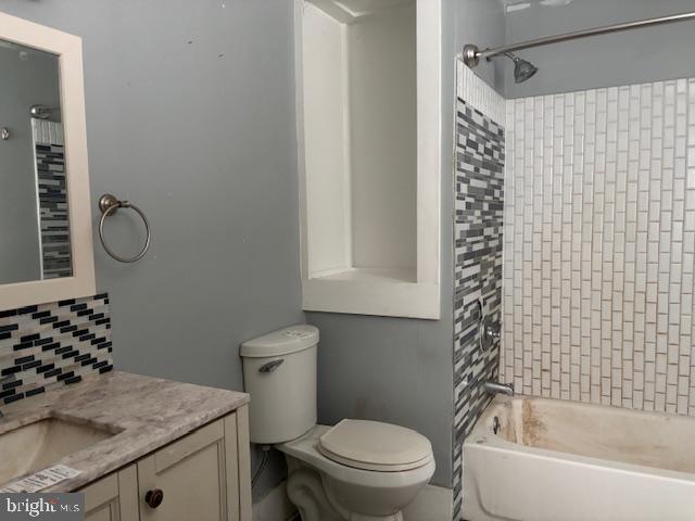 26445 Rapidan Road Rapidan, VA 22733 - Photo 4 of 6 a bathroom with a granite countertop toilet sink and mirror