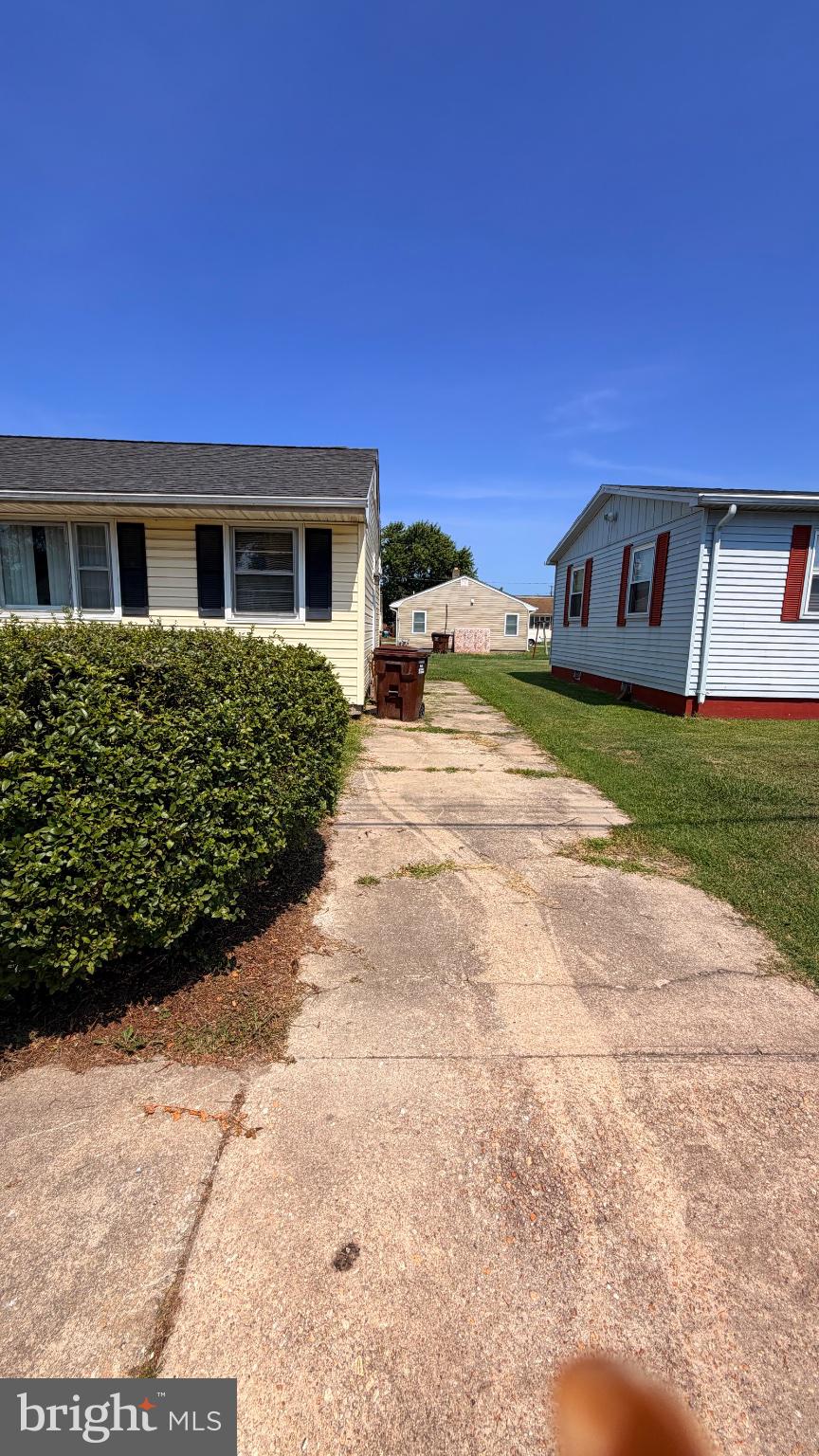 711 Rigby Avenue Cambridge, MD 21613 - Photo 4 of 21 Charming pathway between cozy homes.