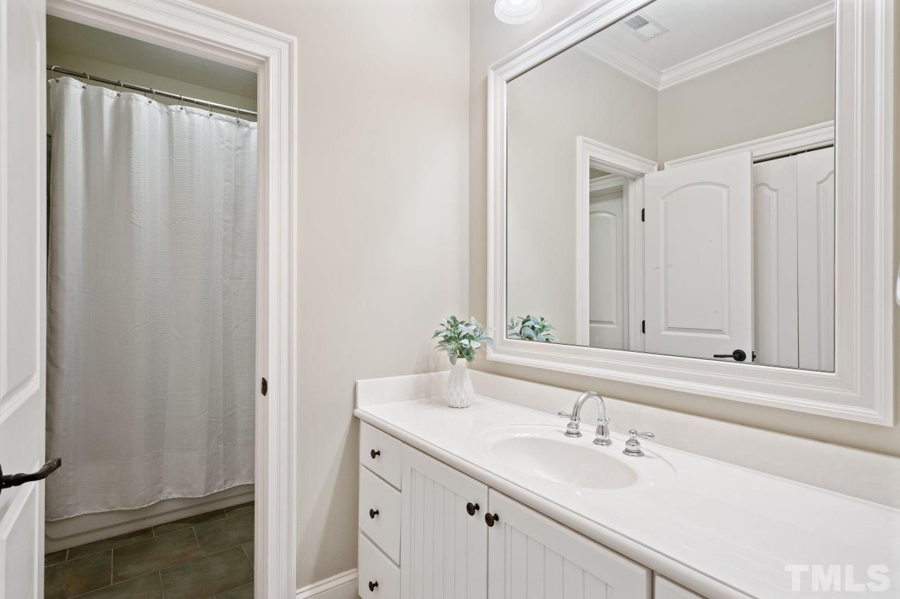 6017 Reedy Creek Road Raleigh, NC 27607 - Photo 22 of 30 This ensuite bath has 2 separate sink areas for privacy and convenience