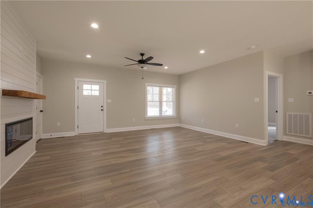 2223 Ridge Road Arvonia, VA 23004 - Photo 8 of 32 Spacious living area featuring wood-finish floorin