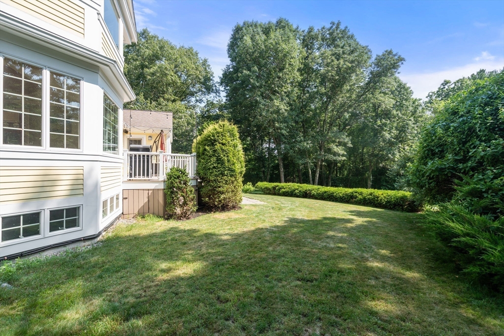 24 Russett Hill Road Sherborn, MA 01770 - Photo 35 of 39 a view of a backyard with a garden