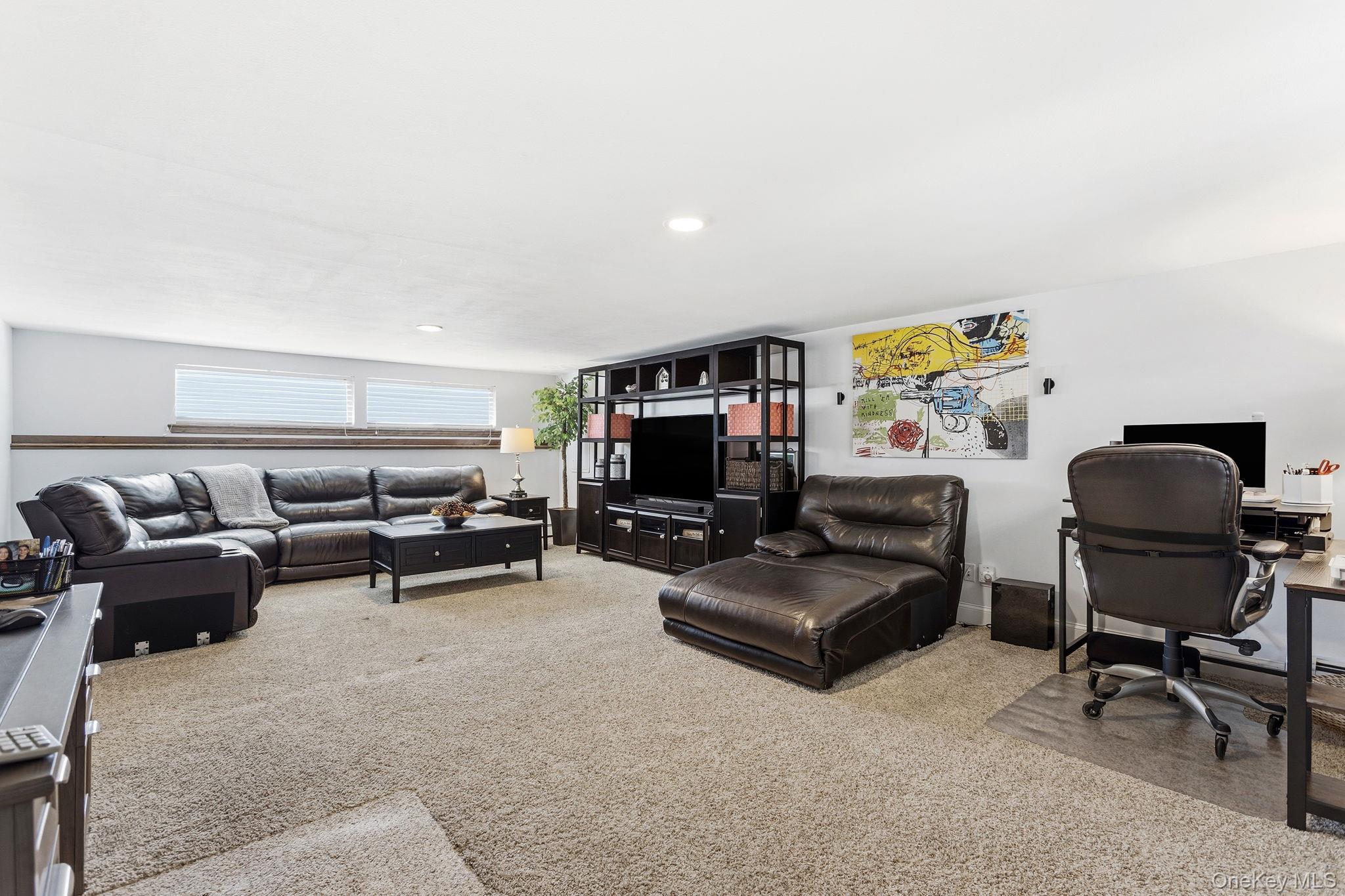 56 Tanager Road Mahopac, NY 10541 - Photo 21 of 30 a living room with furniture and a flat screen tv
