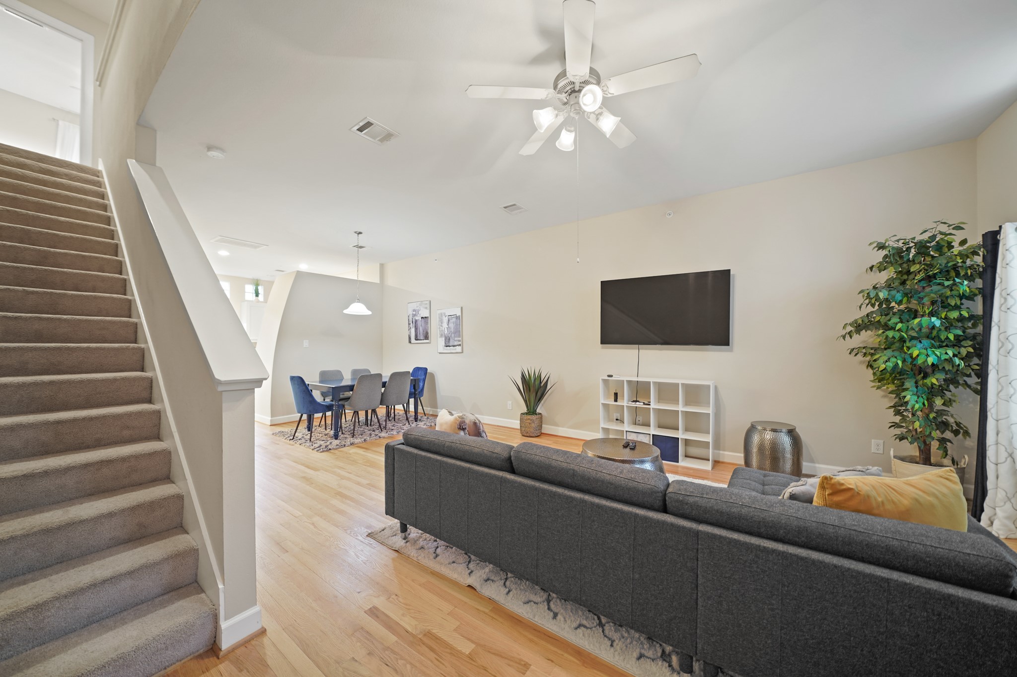 8705 Bryam Street, Unit 104 Houston, TX 77061 - Photo 8 of 16 Elegant staircase connects all three levels, creating an open feel and architectural flow throughout.