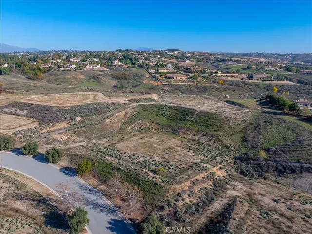 a view of a town with mountains in the background