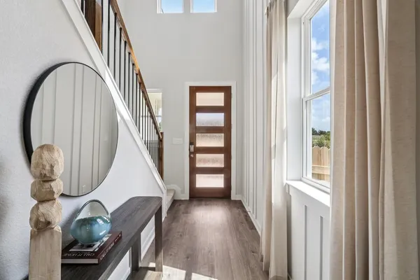 a view of a livingroom with furniture and staircase