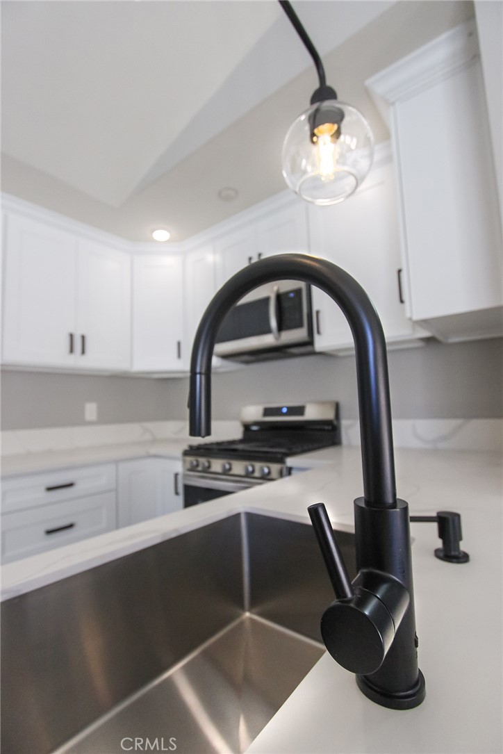 12640 Briarglen Loop, Unit F Stanton, CA 90680 - Photo 8 of 24 New kitchen faucet and lighting